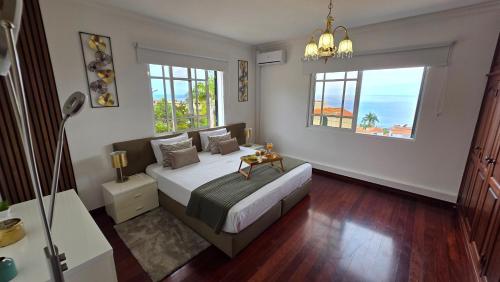 Giường trong phòng chung tại Santa Maria Villa