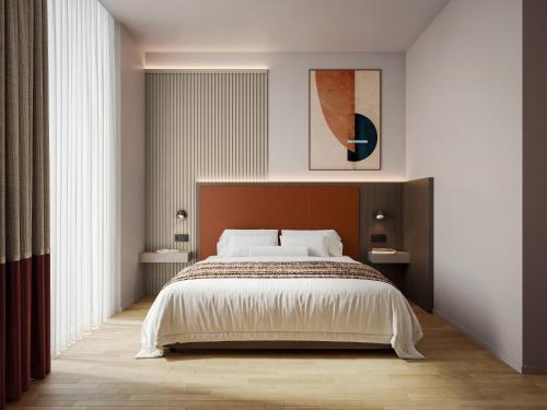 Ένα ή περισσότερα κρεβάτια σε δωμάτιο στο Mokinba Hotels Baviera
