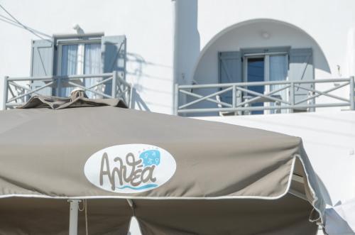 a tent with aania logo on the top of it at Naxian Althea in Agia Anna Naxos