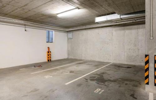 an empty parking lot in a parking garage at Urban nest Pilsen in Plzeň