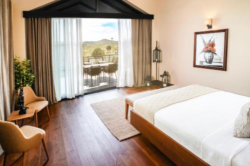 Ένα ή περισσότερα κρεβάτια σε δωμάτιο στο Les Bungalows