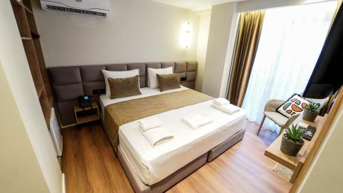 Postel nebo postele na pokoji v ubytování Vion Sea Boutique Hotel - Golem Durrës