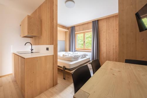 Postel nebo postele na pokoji v ubytování Ama Dolomiti - Residence