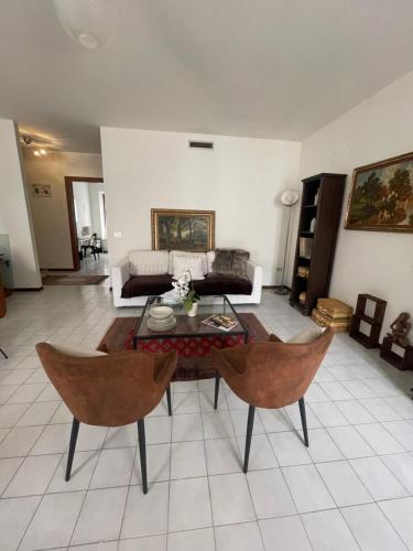 a living room with a couch and a table at Casa Aurora in Borgoforte