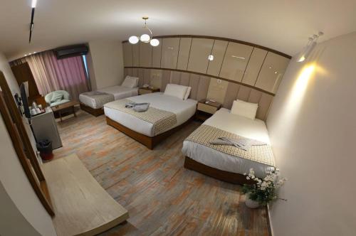 Ένα ή περισσότερα κρεβάτια σε δωμάτιο στο Aura Garden City Hotel