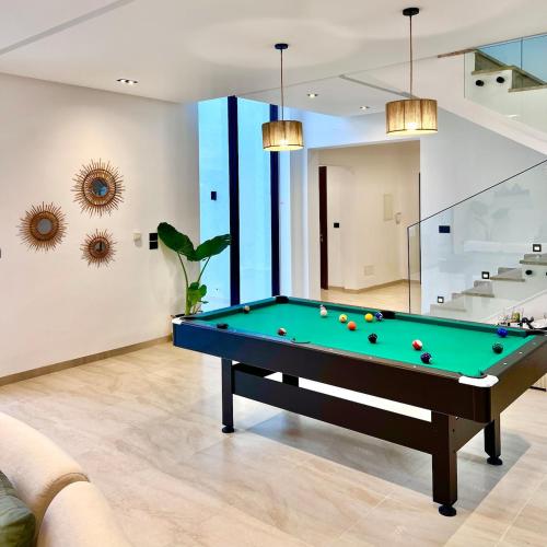 a billiard room with a pool table in a house at Villa Ubud Hammamet in Hammamet Sud
