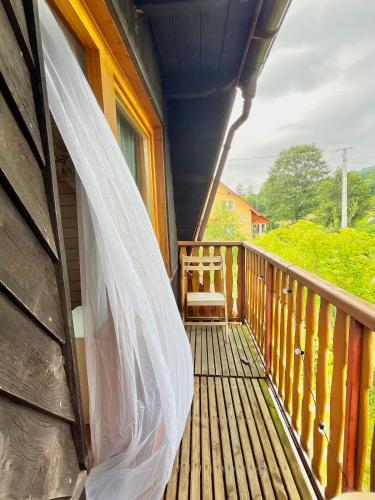 a wedding veil hanging on a porch of a house at Dom Ponad Wsią in Zawoja