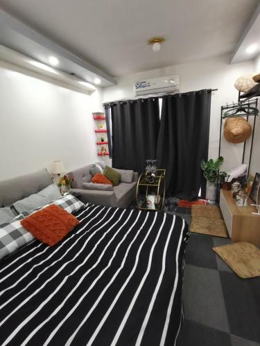 Postel nebo postele na pokoji v ubytování Staycation by ben