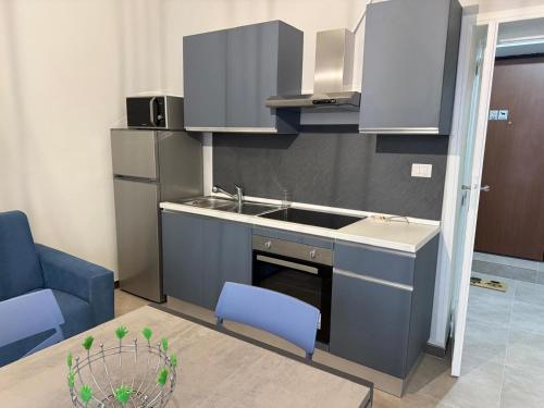 a small kitchen with a sink and a counter at L'approdo di Odisseo in Pizzo