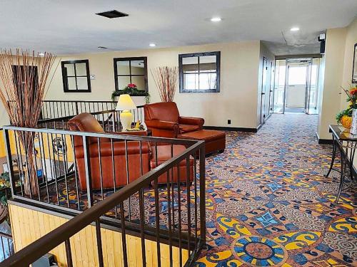 a lobby with a couch and chairs in a room at The Lodge at Russell - Russell Inn in Russell