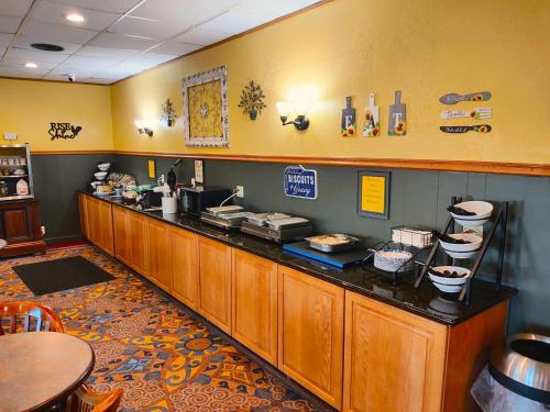 a food counter in a restaurant with a counter at The Lodge at Russell - Russell Inn in Russell