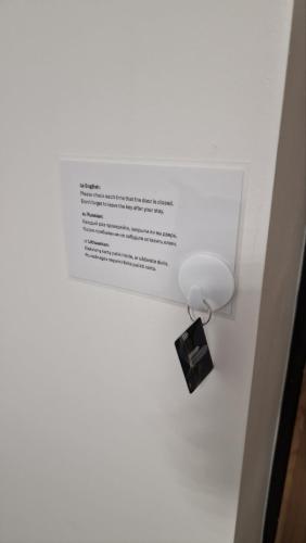 a box with a light on top of a wall at RentA Citywalk Flat in Kaunas