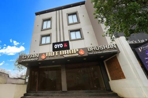 a building with a sign on the front of it at Hotel O Gyan Regency in Raipur