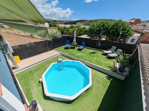 a swimming pool on the roof of a house at Casa Joana in Canyelles