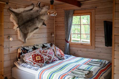 En eller flere senge i et værelse på Wilderness cottage 6 people