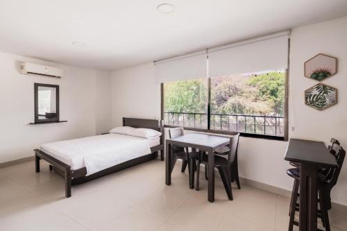 Katil atau katil-katil dalam bilik di Aparta Hotel Roca Marina