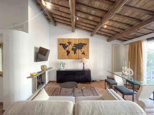 a living room with a couch and a table at Attic Castel Sant'Angelo - Pantheon in Rome