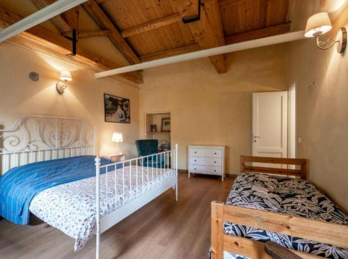Ένα ή περισσότερα κρεβάτια σε δωμάτιο στο Depandance Cascina Vicentini