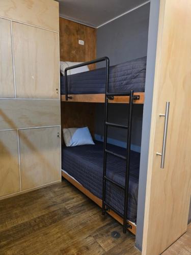 a couple of bunk beds in a room at sabina nuevo aeropuerto x12 in Lima