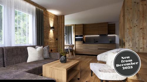 un soggiorno con un divano e un tavolo di La Perle Apartments a Zermatt