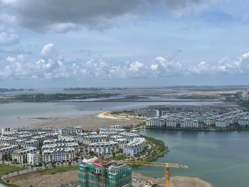 an aerial view of a city next to a body of water at Home Stay ICON40 Hạ Long Khách sạn cao cấp in Ha Long