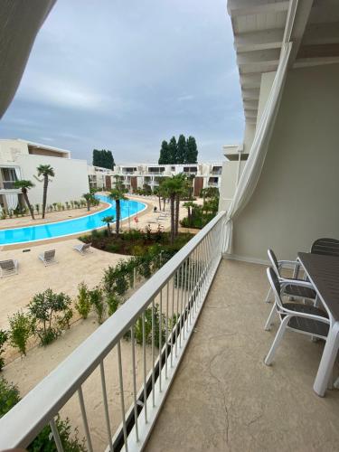 a balcony with a view of the pool at Wave Island in Lido di Jesolo