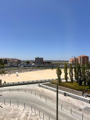 a view of a large plaza with trees and buildings at Villa Rossio in Aveiro