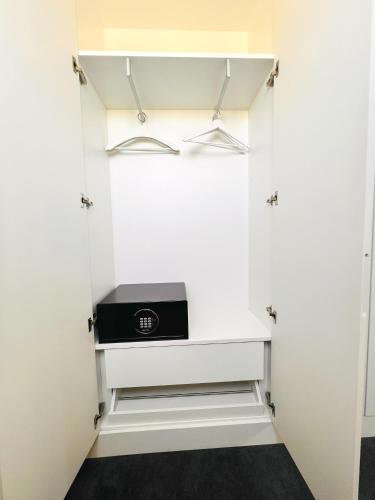 a walk in closet with a stove in it at Villa Rossio in Aveiro
