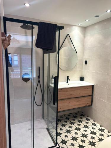 a bathroom with a shower and a sink at Catedral Suite - Vistas a la Catedral & Parking in León