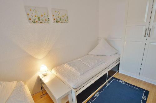 Postel nebo postele na pokoji v ubytování Grömitz-Center Whg 206