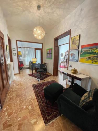 a living room with a couch and a piano at Ars in Villa in Livorno