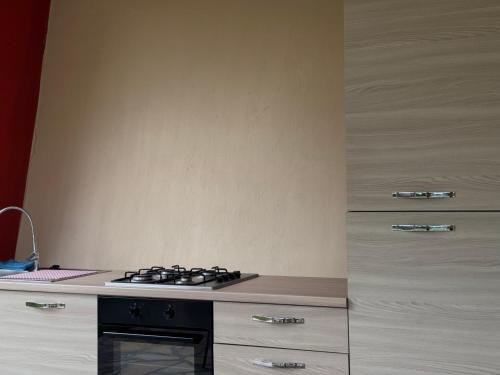 a kitchen with a stove and a counter top at Ligo in Villanova dʼAlbenga