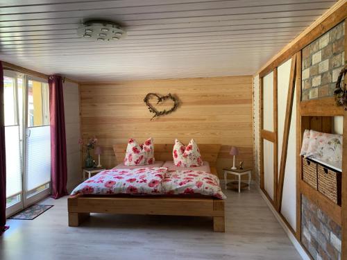 a bedroom with a bed with pillows on it at Inas Spreewaldstube in Vetschau
