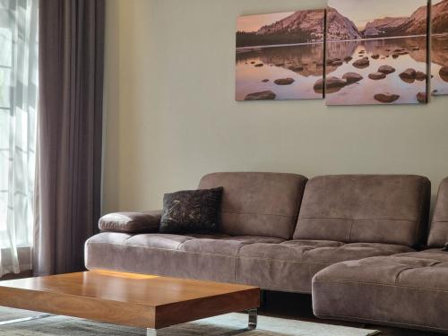a living room with a couch and a coffee table at Premium Apartment by Bakuapart in Baku