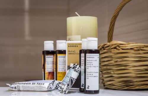 a group of four products sitting next to a candle at Iphimedeia Luxury Hotel & Suites in Naxos Chora