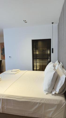 Una cama o camas en una habitación de Hotel Ari Gjakove