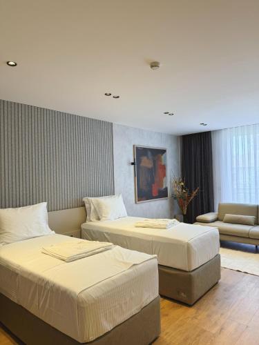 Una cama o camas en una habitación de Hotel Ari Gjakove