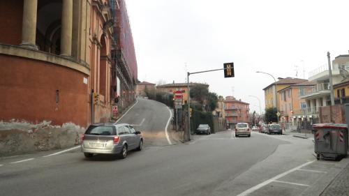 a car driving down a street with a skateboard ramp at All' Ombra del Portico in Bologna