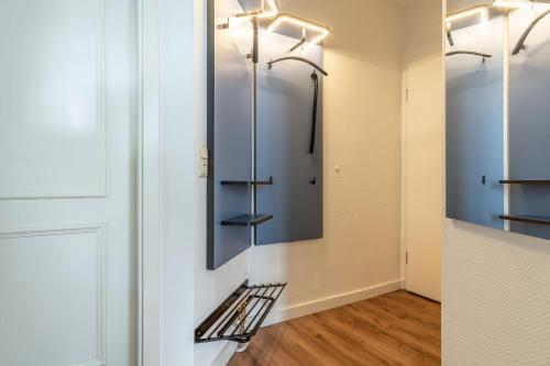 a walk in shower in a bathroom with glass doors at Ferienwohnung 13 Villa Eden in Binz