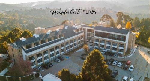 an overhead view of a building with a parking lot at WANDERLUST Experience Hotel in Campos do Jordão