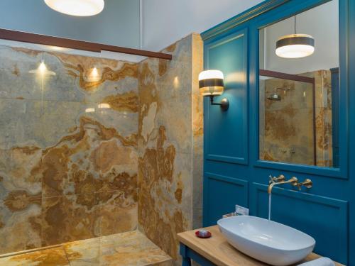 a bathroom with a sink and a shower at Palazzo Sapori in Soriano nel Cimino