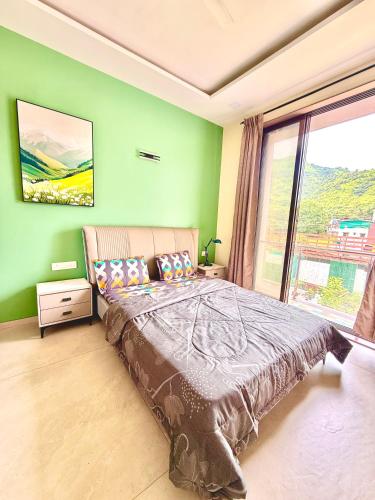 a bedroom with a bed and a large window at White Forest villa in Lonavala