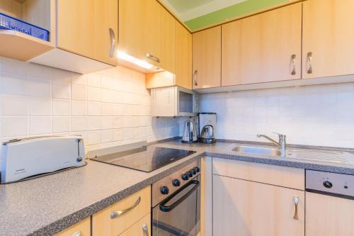 a kitchen with a sink and a counter top at Haus Tarnewitz, Ferienwohnung 06 in Tarnewitz