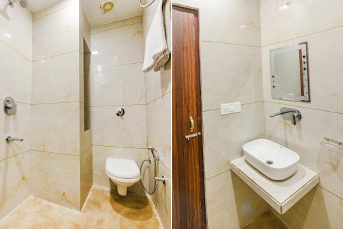 a bathroom with a shower and a toilet and a sink at SOLACE INN near GOLDEN temple in Amritsar