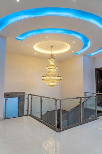 a ceiling with a chandelier in a room at SOLACE INN near GOLDEN temple in Amritsar