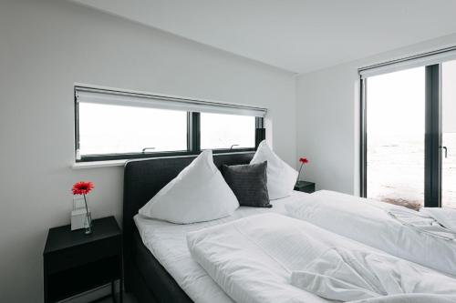 Ένα ή περισσότερα κρεβάτια σε δωμάτιο στο Ferienhaus "Nurso"