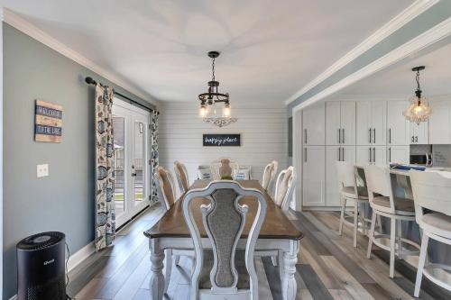 a dining room and kitchen with a table and chairs at FLAT Lakefront Home w/ Dock-Kayaks-Paddle Board in Sandlick