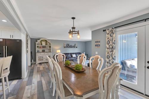 a dining room and kitchen with a table and chairs at FLAT Lakefront Home w/ Dock-Kayaks-Paddle Board in Sandlick