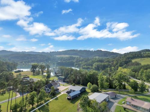 an aerial view of a village with a river and mountains at FLAT Lakefront Home w/ Dock-Kayaks-Paddle Board in Sandlick