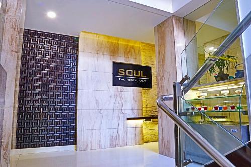 a lobby with a sign on the wall of a building at The Oriental Residency in Mumbai